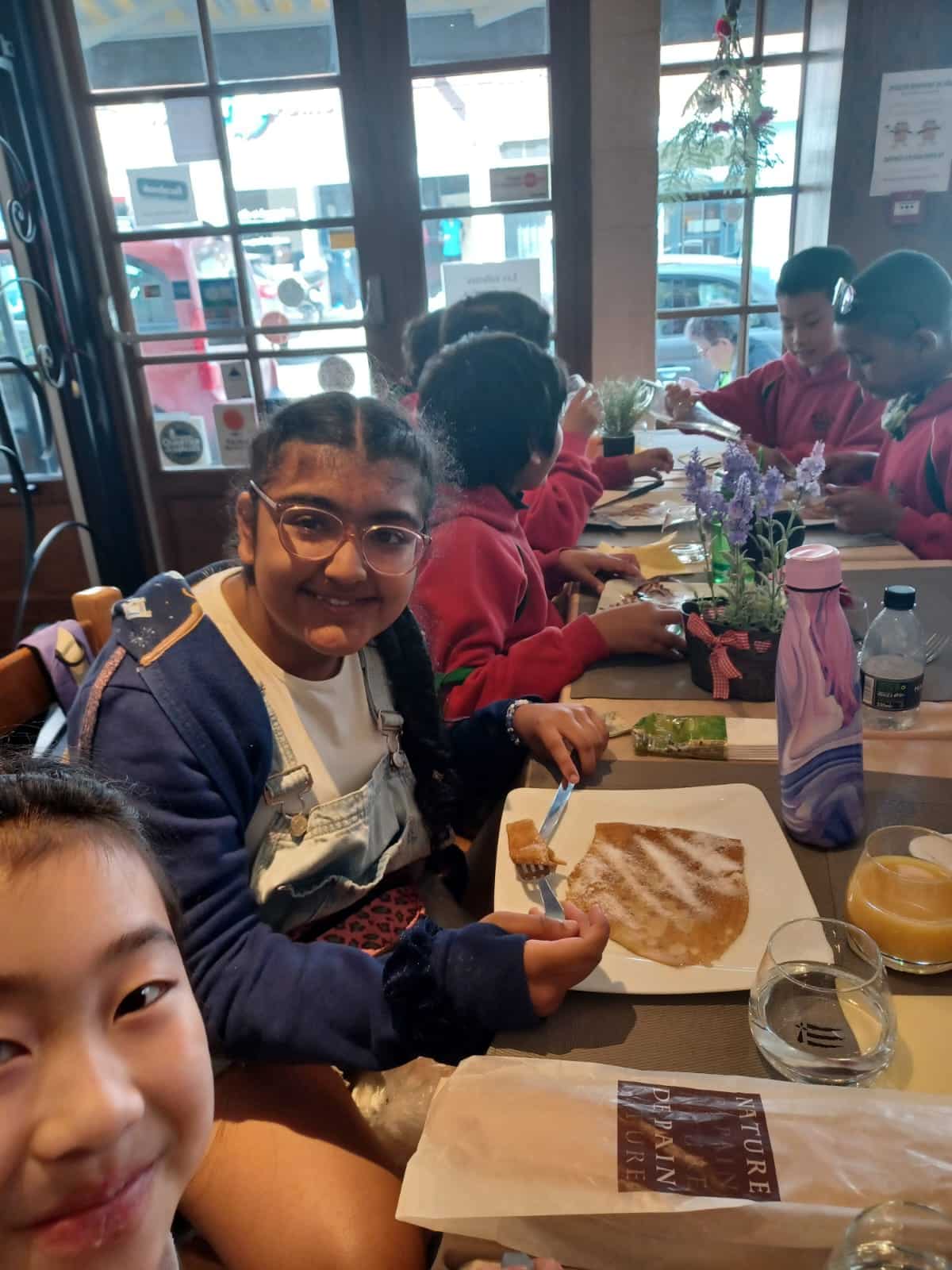 Girls eating crepes in France